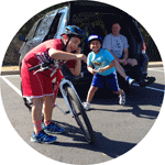 Jacob and Gabriel laughing it up during a break during their cycling lessons